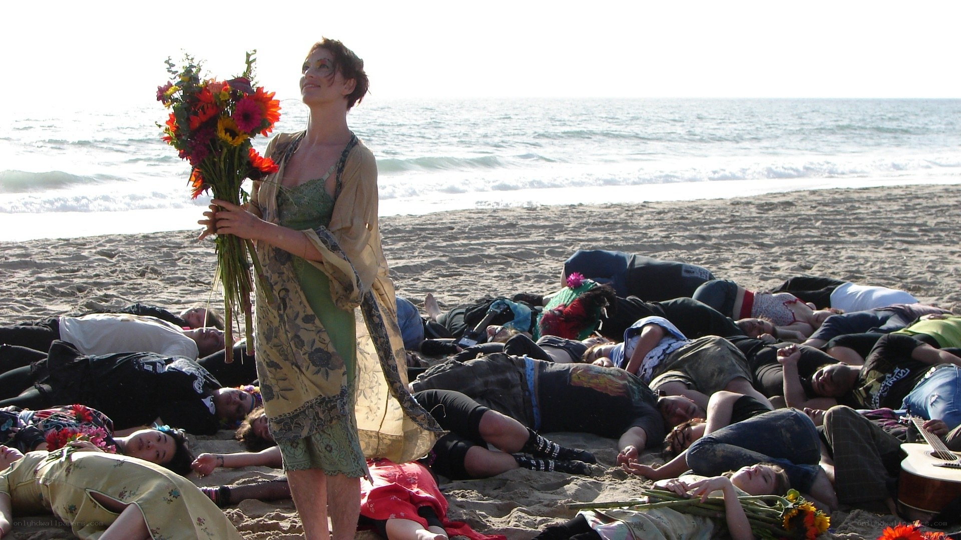 Woman with flowers on beach