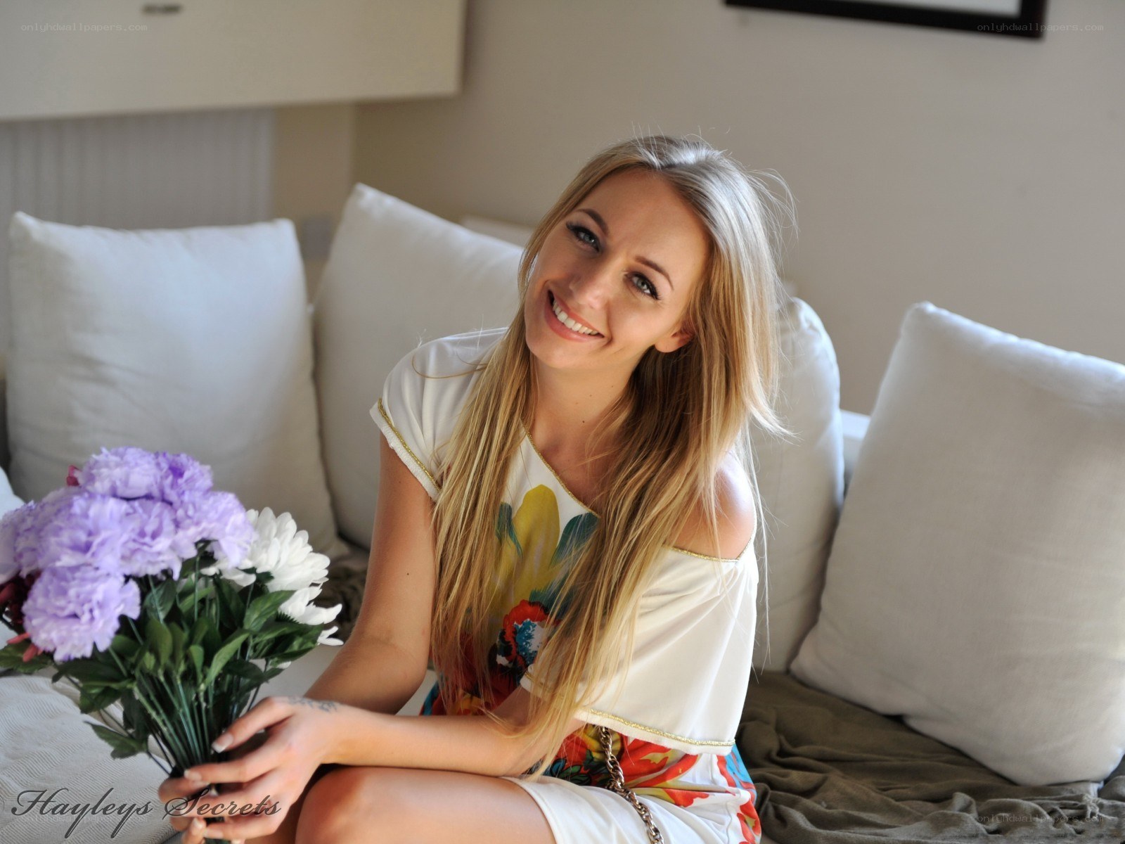 woman with flowers on couch