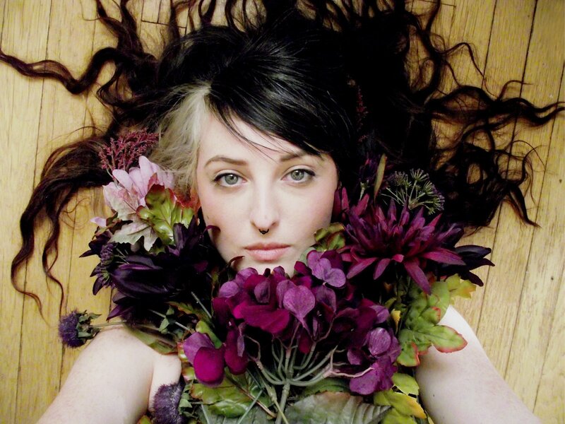 woman with flowers on floor