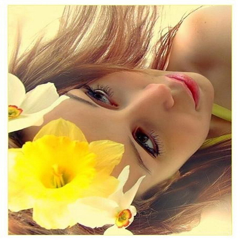 woman with flowers on her face