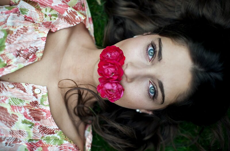 woman with flowers on her face