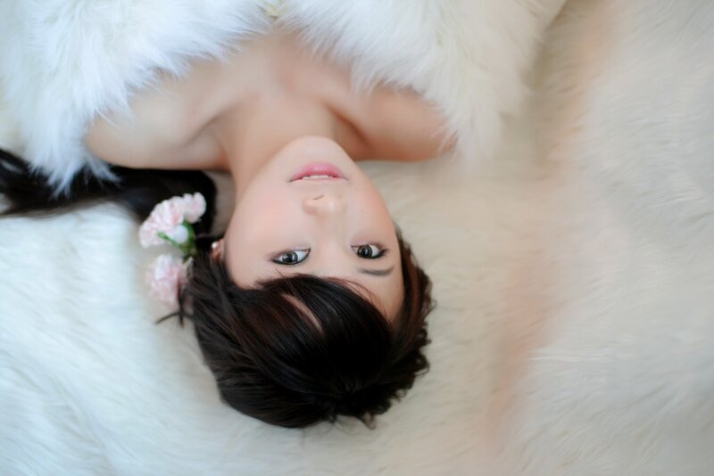 woman with flowers on white fur