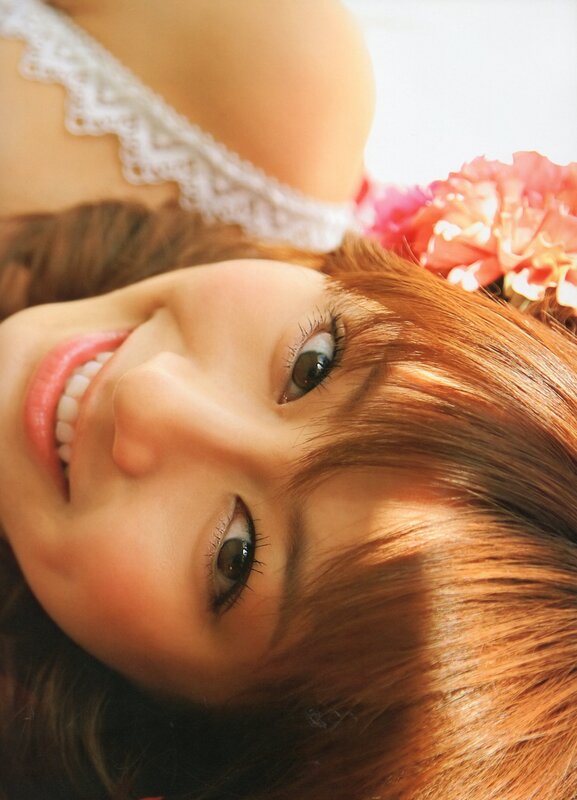 woman with flowers smiling