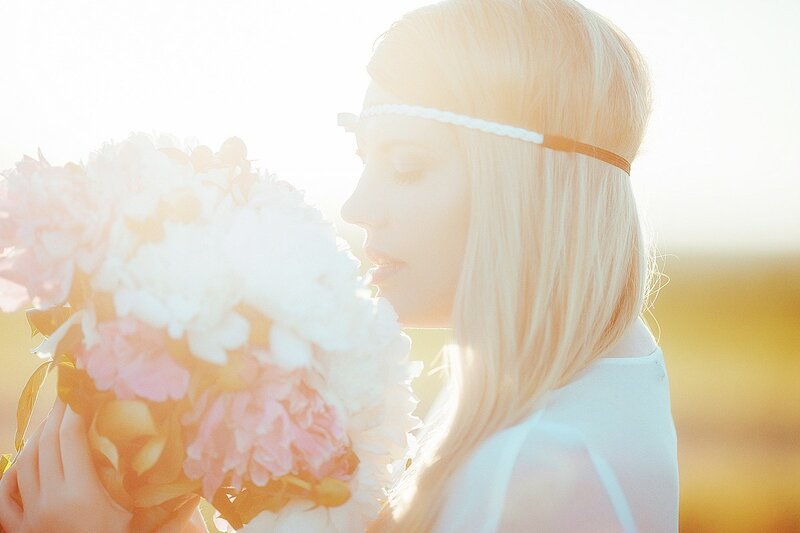 Woman with Flowers — White, Serene, Sunset