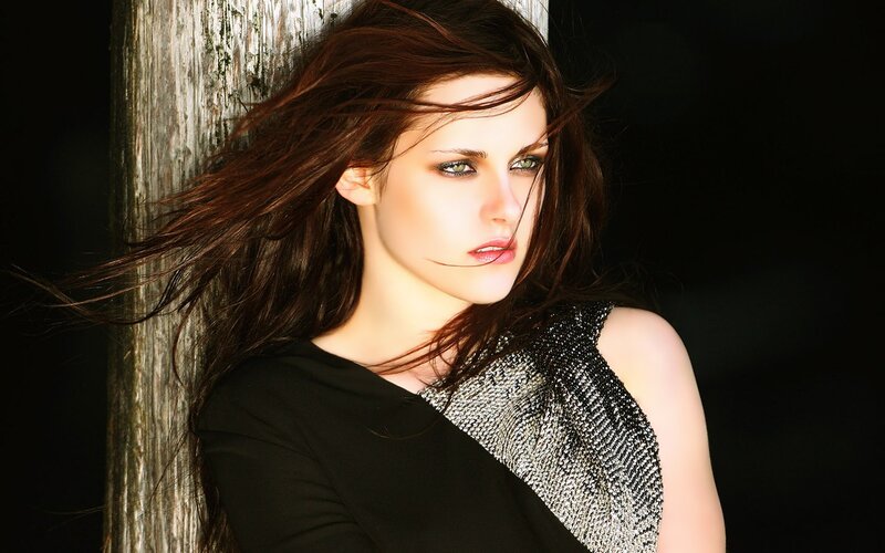woman with flowing hair against wood