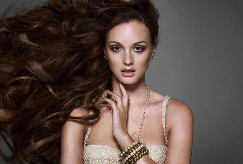 woman with flowing hair and jewelry