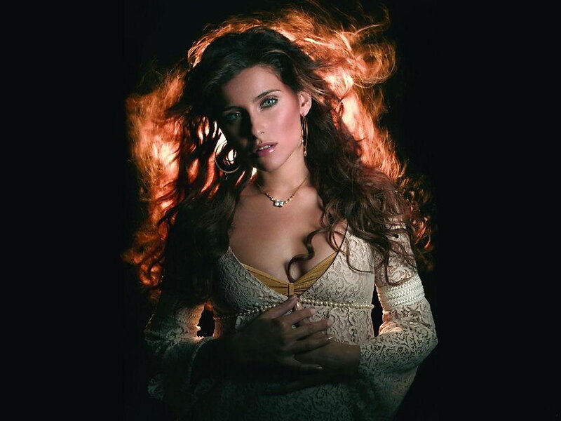 woman with flowing hair in dramatic lighting