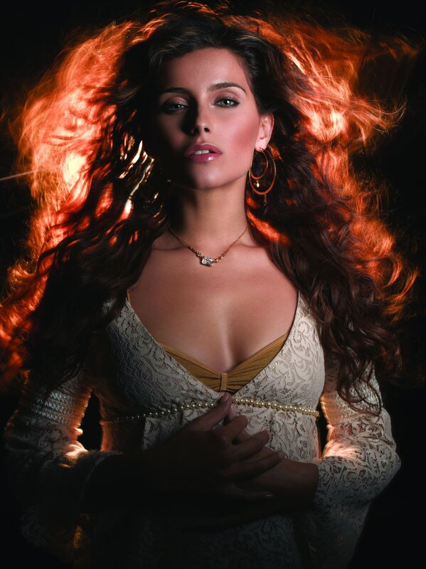 woman with flowing hair in dramatic lighting