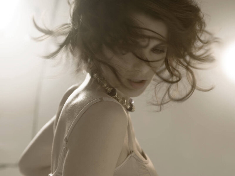 woman with flowing hair in light