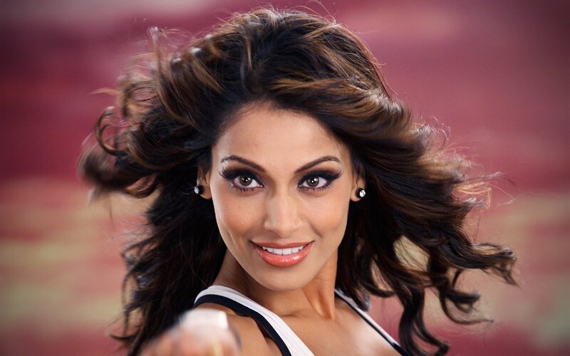 woman with flowing hair smiling