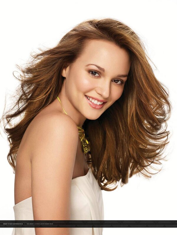 woman with flowing hair smiling