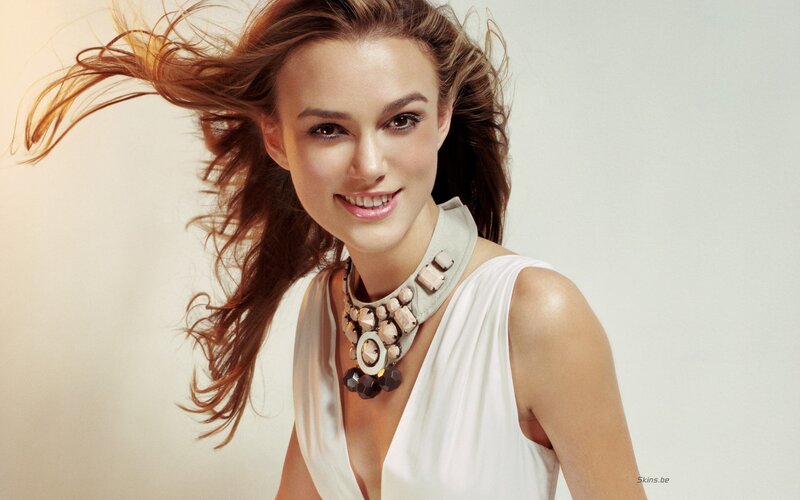 woman with flowing hair smiling