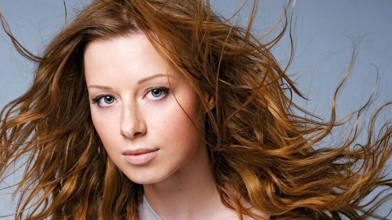 woman with flowing red hair