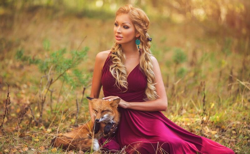 Woman with Fox in Field