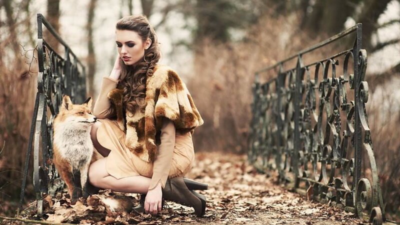 Woman with Fox on Bridge