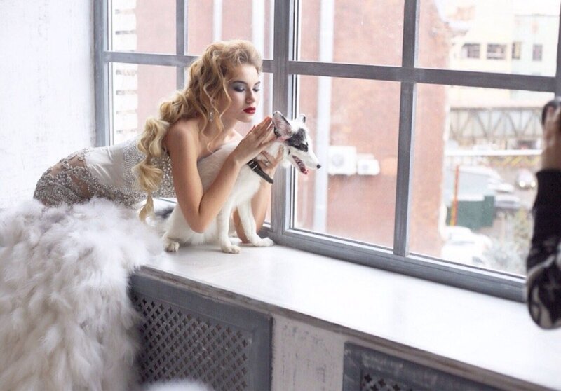 Woman with Fox on Windowsill