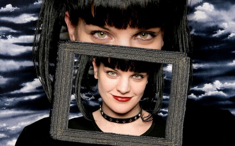 Woman with frame in front of face