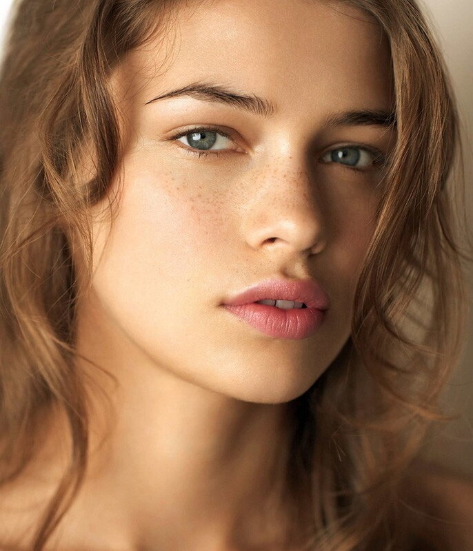 woman with freckles and blue eyes