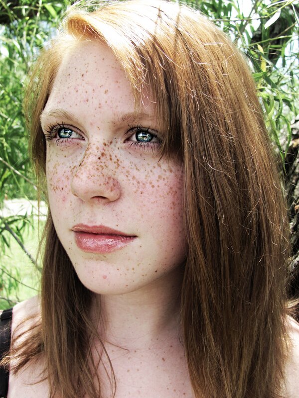 woman with freckles and blue eyes