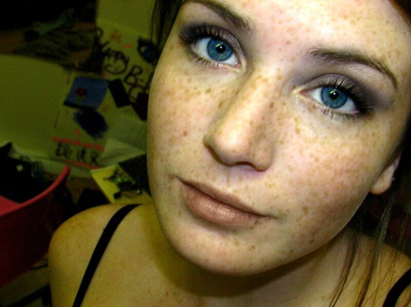 woman with freckles and blue eyes