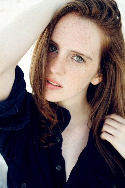 woman with freckles and blue eyes