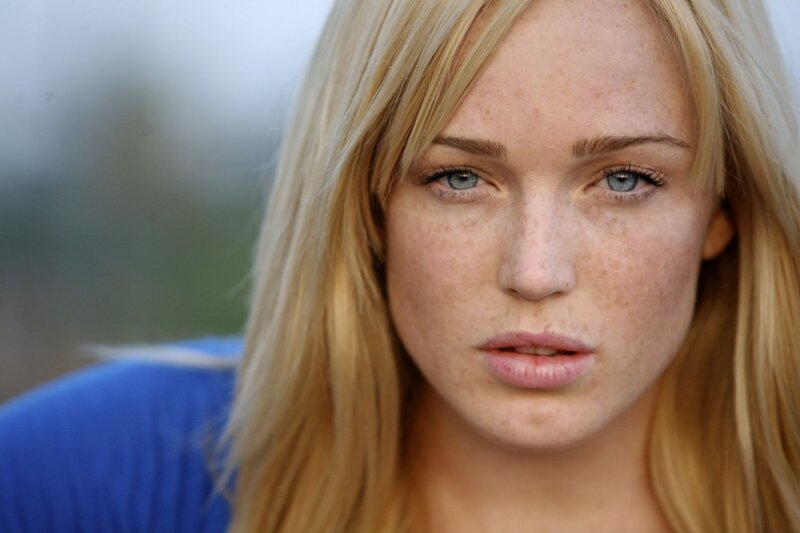 woman with freckles and blue eyes
