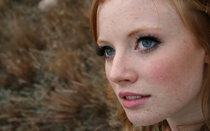 woman with freckles and blue eyes