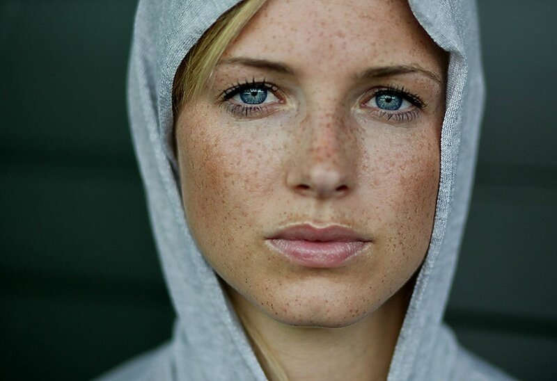 woman with freckles and blue eyes