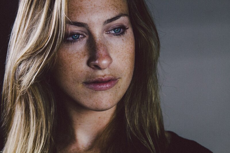woman with freckles and blue eyes