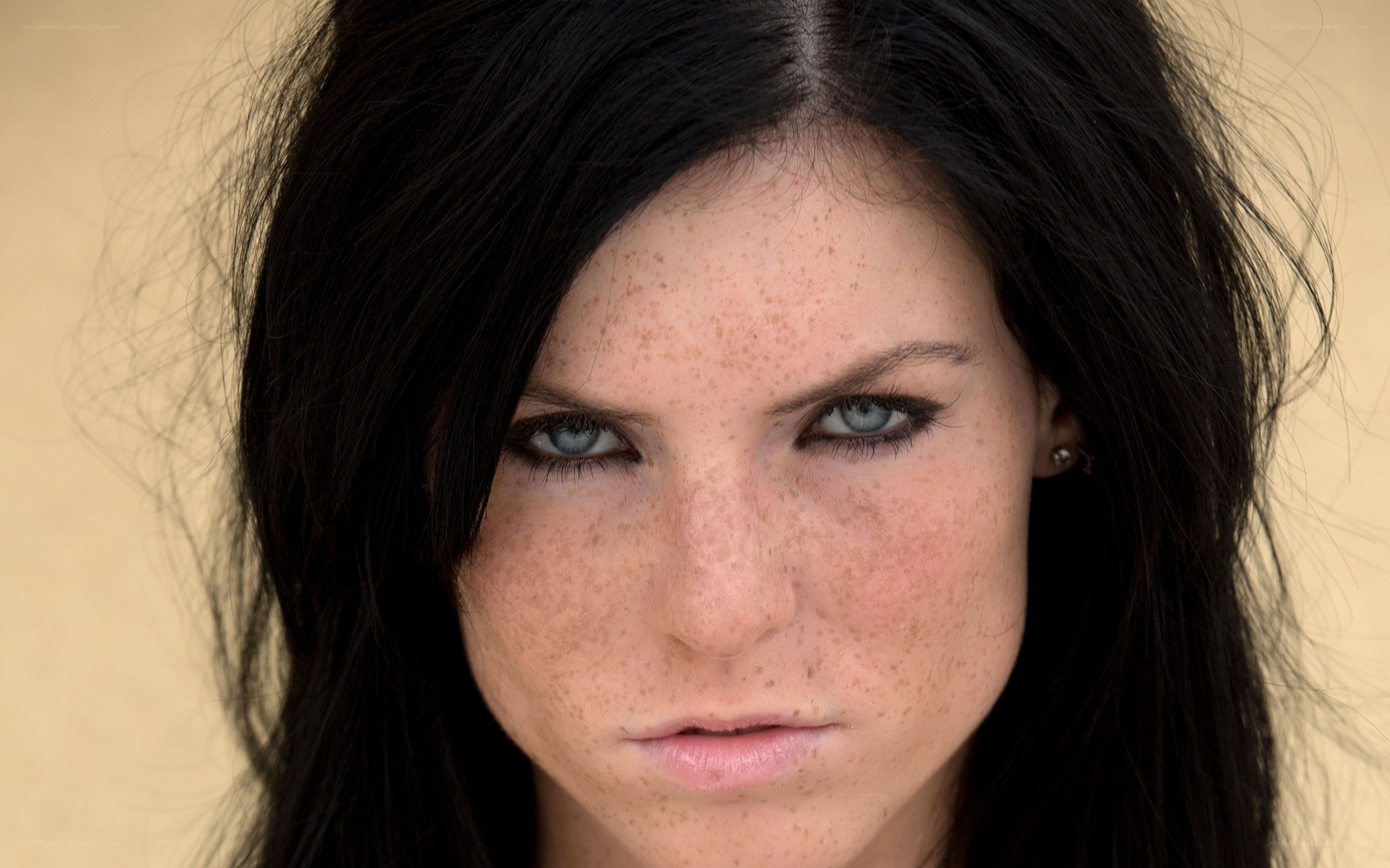 woman with freckles and blue eyes