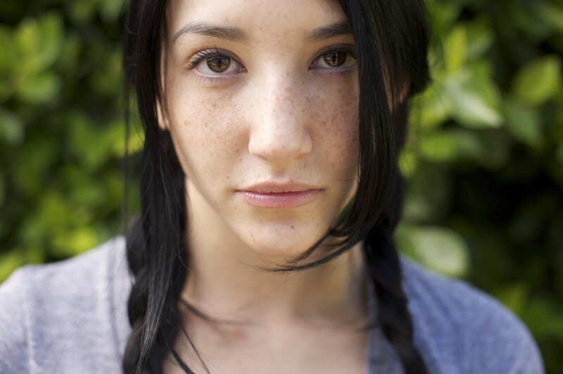 woman with freckles and braids