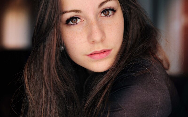 woman with freckles and brown eyes