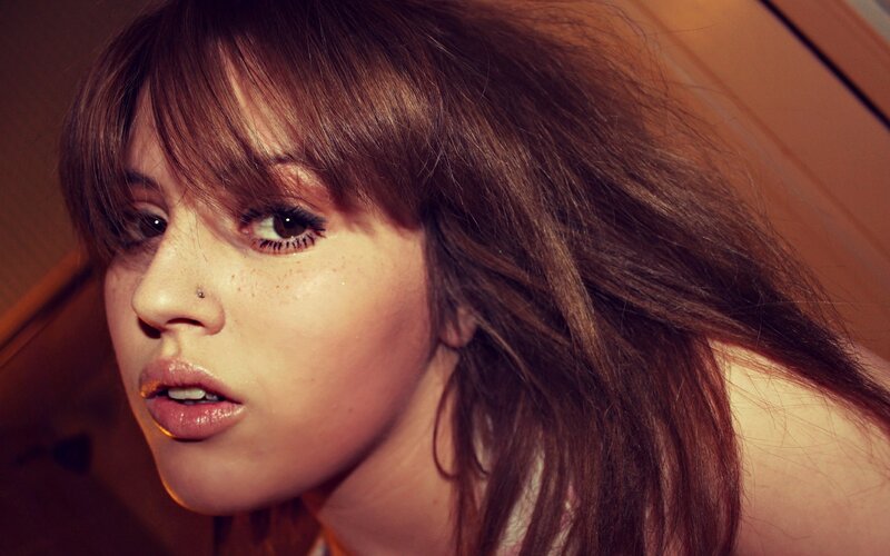 woman with freckles and brown hair