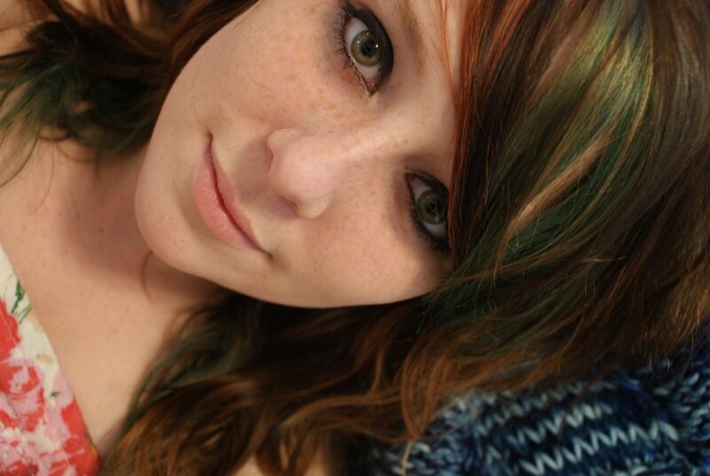 woman with freckles and colored hair