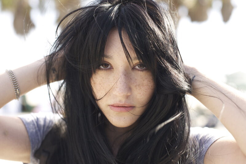 woman with freckles and dark hair