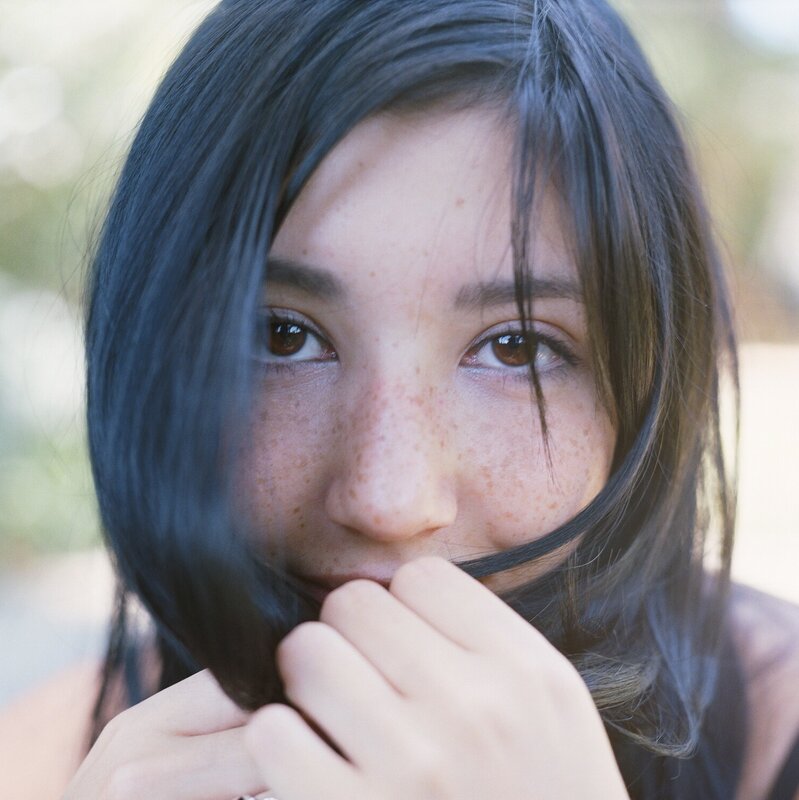 woman with freckles and dark hair