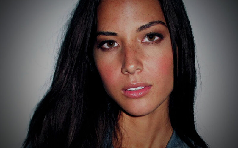 woman with freckles and dark hair