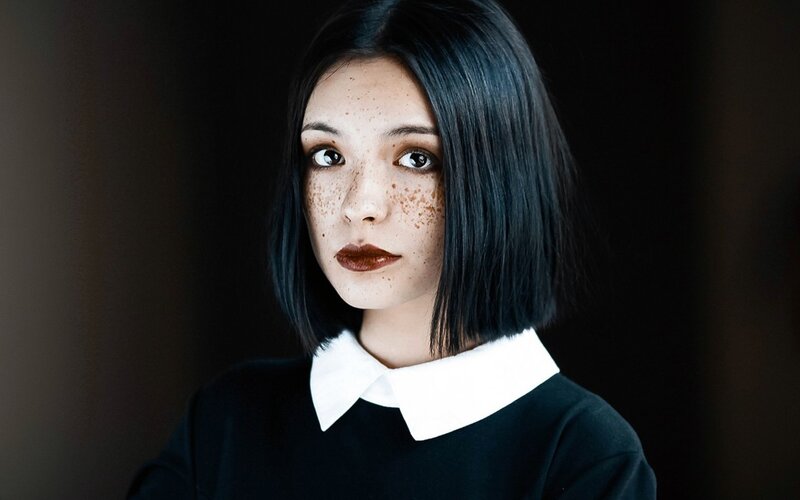 woman with freckles and dark hair