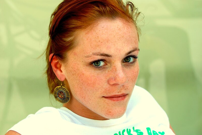 woman with freckles and earrings