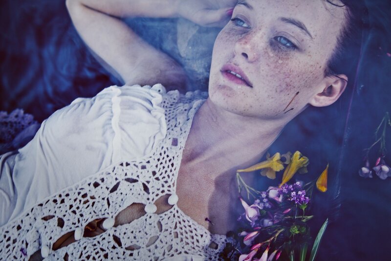 woman with freckles and flowers