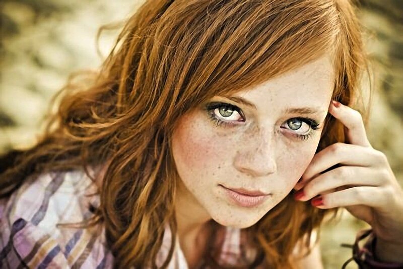 woman with freckles and green eyes