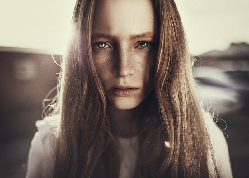 woman with freckles and green eyes