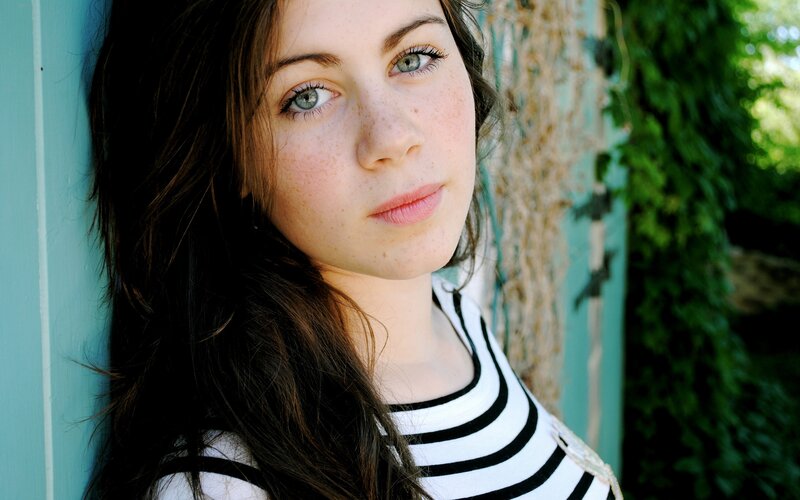woman with freckles and green eyes