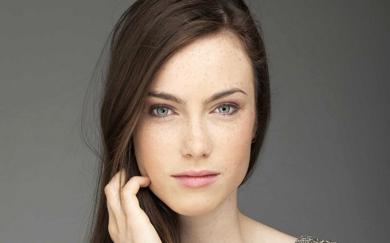 woman with freckles and green eyes