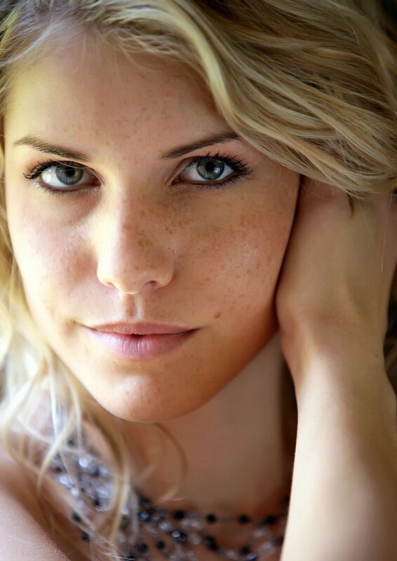 woman with freckles and green eyes