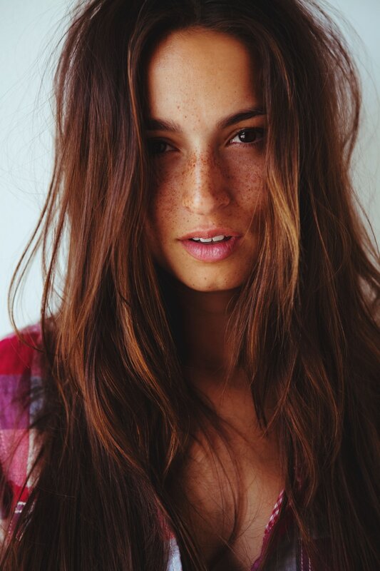 woman with freckles and long hair
