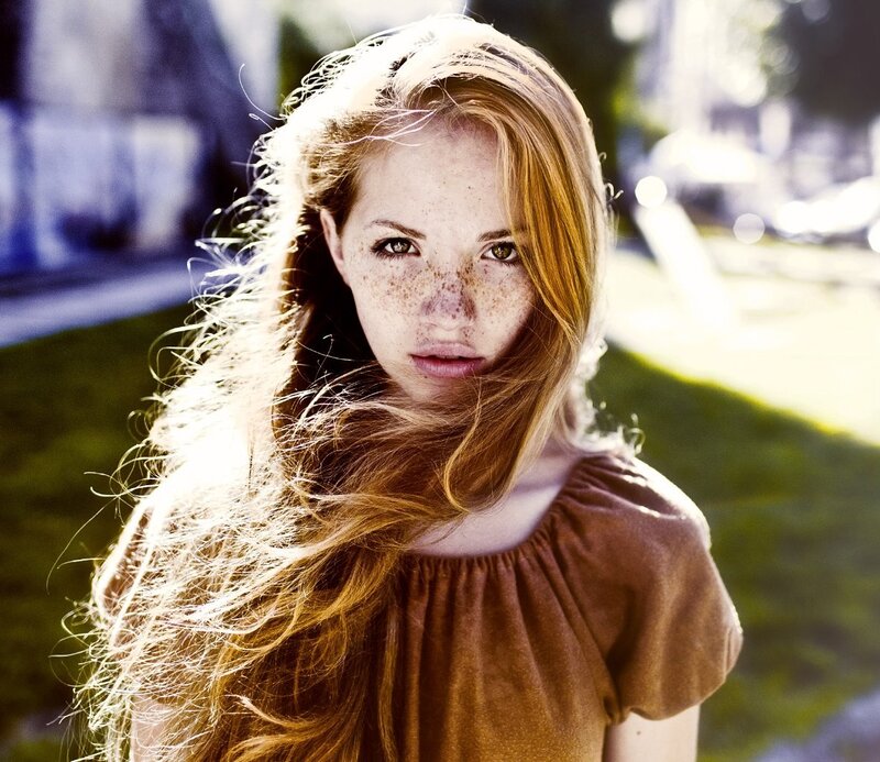 woman with freckles and long hair