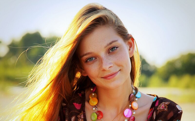 woman with freckles and long hair
