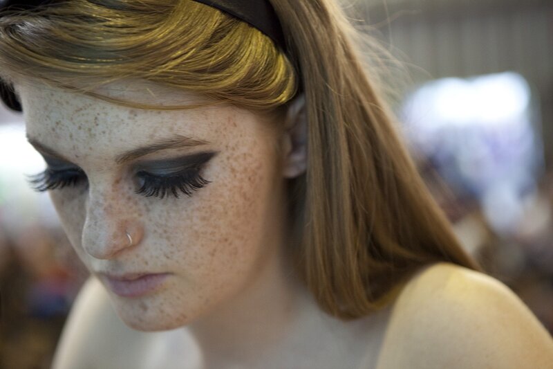 woman with freckles and makeup