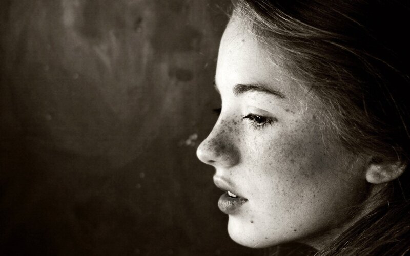 Woman with Freckles — Black, Contemplative